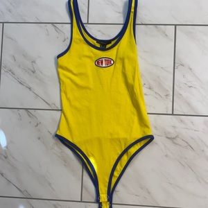 Bright yellow one piece top. Perfect with a pair of jeans. Only worn once.